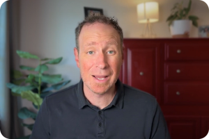 Jay Parrish Fredericksburg Virginia real estate agent recording a market update video in a home office.